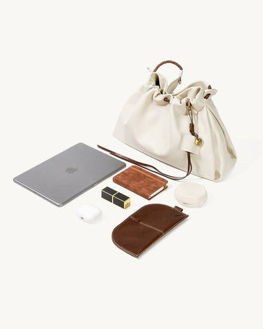 Cream leather Small Gather Bag Set shown with an iPad, AirPods, lipstick, notebook, and glasses case to illustrate capacity.