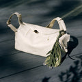 Morning Dew in Paris charm in Forest green leather with leaf design and beads.