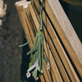 Forest green leather charm with leaf design and clear beads, inspired by Paris. A Songmont accessory.