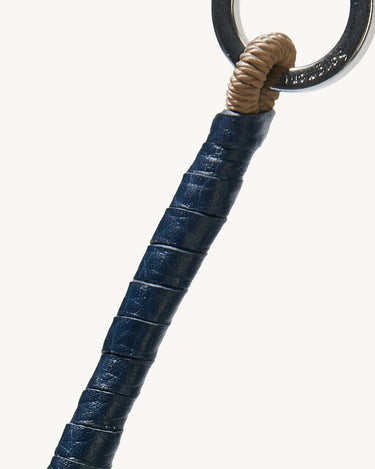 Denim Wish Seeds Charm with navy leather wrap and braided cord detail on silver ring.