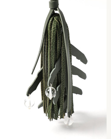 Songmont "Morning Dew in Paris" charm in forest green leather with clear crystal beads and leaf cut-outs.