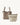Medium Song Bag in taupe leather with a removable beige canvas inner pouch. Features adjustable strap and magnetic closure.