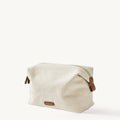 Songmont canvas storage bag with leather details, perfect for cosmetics and travel.