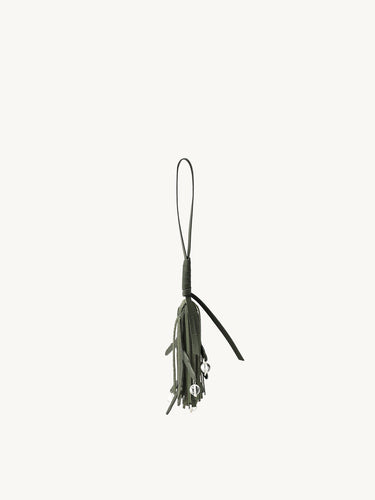 Forest green leather tassel charm for bags with clear beads, featuring embossed Songmont logo.