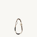 Small Carefree Thread Charm in Sandal, featuring alternating sandalwood and soapberry seeds with woven leather diamonds.
