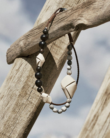 Small Carefree Thread Charm in Sandal with dark wood, stone, and leather charms
