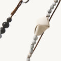 Small Carefree Thread Charm in Sandal with bodhi seeds, sandalwood beads, and leather diamond. Features metallic clasp.