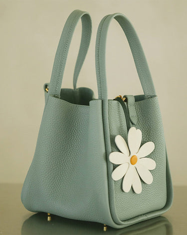 Light blue leather daisy charm handbag with white daisy decoration