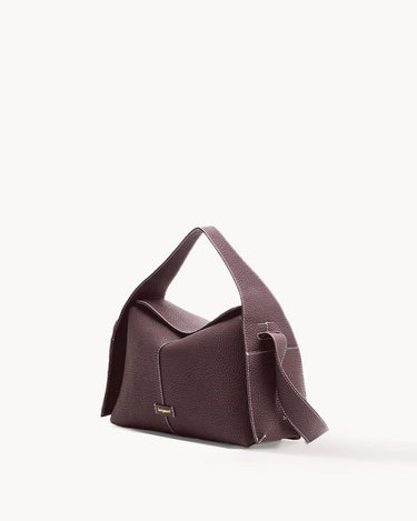 Drippy Roof Bag in burgundy full-grain leather with white stitching and gold logo.