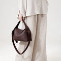 Burgundy Drippy Roof Bag made of full-grain leather with adjustable strap, elegant tote bag.