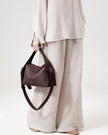 Burgundy Drippy Roof Bag made of full-grain leather with adjustable strap, elegant tote bag.