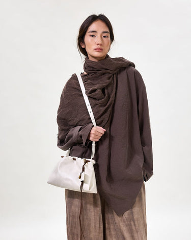 Gather Clutch Set in Cloud: Soft Nappa leather bag with contrast tone details and adjustable strap.