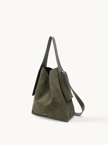 Olive green large drippy tote bag with adjustable strap and side pocket.