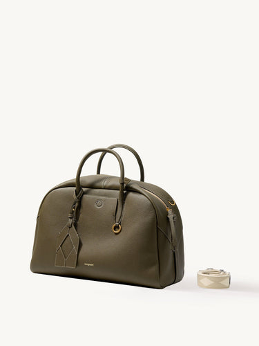 Large Moss Yore Bowling Bag with textured leather and detachable patterned strap.