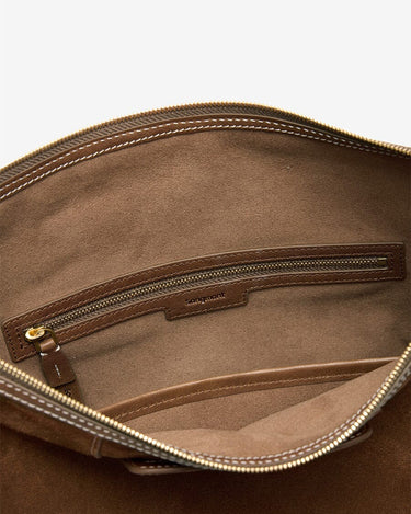 Interior of Large Yore Hobo Bag in Sandal Suede, showing suede lining and zippered pocket with Songmont logo.