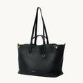 Large Yore Tote Bag in Onyx black full-grain leather with gold hardware. Spacious, shape-shifting design.