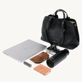Black Songmont Large Yore Tote Bag with laptop, camera, power bank, notebook, and water bottle