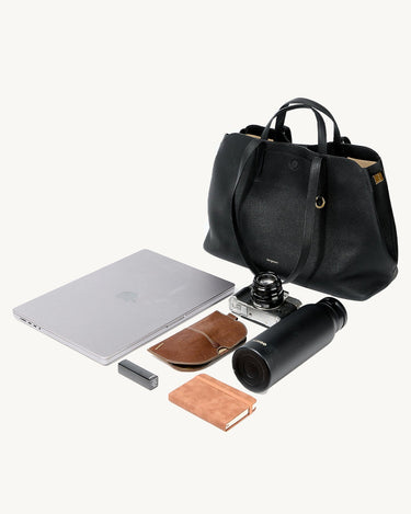 Black Songmont Large Yore Tote Bag with laptop, camera, power bank, notebook, and water bottle
