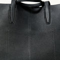 Onyx black full-grain leather Large Yore Tote Bag detail: pebbled texture and stitching.