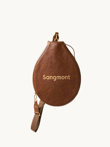 Brown vegetable-tanned leather tennis racket cover with 'Songmont' embossed in gold.