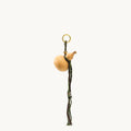 Lucky Gourd Charm in Cypress: natural gourd, braided cord, gold keyring. Symbol of luck and wealth.
