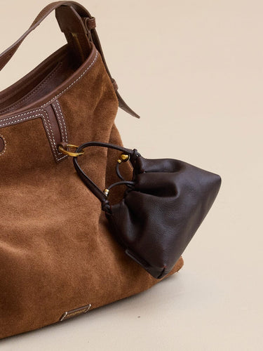 Lucky Pouch Charm: Brown suede shoulder bag with dark brown leather pouch, adjustable strap.