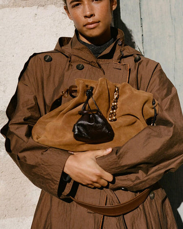 Lucky Pouch Charm in tan suede with black leather drawstring and beaded charm