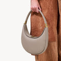 Luna Bag in Cobble, textured full-grain leather handbag with gold hardware and magnetic closure.