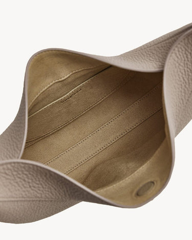 Luna Bag in Cobble color, showing textured leather interior and compartments.