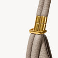 Luna Bag in Cobble color with textured leather strap and gold hardware featuring 'SONGMONT' logo.