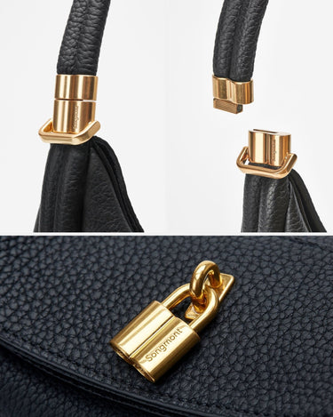Black leather Luna Bag with gold hardware and magnetic clasp, featuring the Songmont logo.
