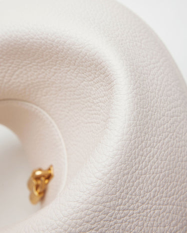 Luna Bag in Eco Cloud vegan leather, showcasing its textured finish and gold hardware detail.