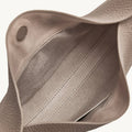 Interior of a gray full-grain leather Luna Bag, showing fabric lining and stitching.