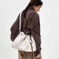 Medium Gather Bag Set in Cloud: Soft Nappa leather tote bag with drawstring closure and adjustable strap.