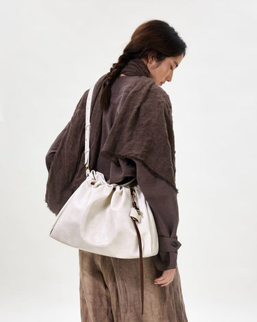Medium Gather Bag Set in Cloud: Soft Nappa leather tote bag with drawstring closure and adjustable strap.