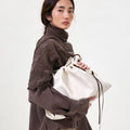 Medium Gather Bag Set in Cloud white Nappa leather with adjustable straps and a unique gathered design.