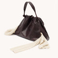 Medium Gather Bag Set in ebony full-grain nappa leather with adjustable straps.