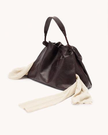 Medium Gather Bag Set in ebony full-grain nappa leather with adjustable straps.