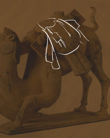 Gather bag inspired by camel caravans, sketch overlay on a camel figurine.