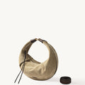 Large Luna Hobo Bag in dune suede with dark brown leather accents and a detachable strap.