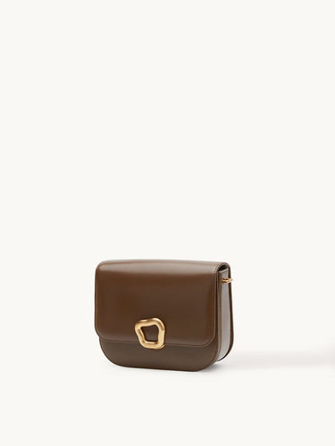 Medium Reset Tofu Bag in Caramel calfskin leather with gold buckle closure.