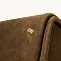 Medium Song Bag in Agarwood nubuck leather with gold hardware detail.