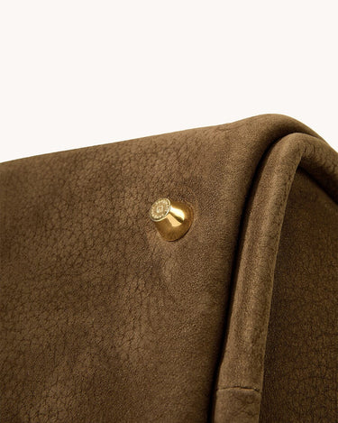 Medium Song Bag in Agarwood nubuck leather with gold hardware detail.
