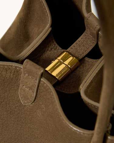 Medium Song Bag in Agarwood: Textured nubuck leather with gold magnetic closure, "Songmont" logo detail.