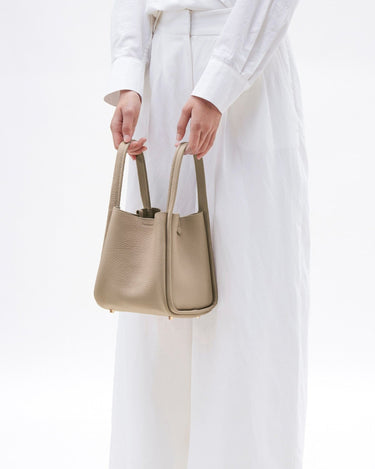 Medium Song Bag in Cream Apricot, full-grain leather with a textured finish and gold hardware details.