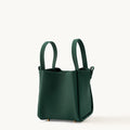 Emerald Medium Song Bag: structured leather bucket bag with two top handles and protective metal feet.