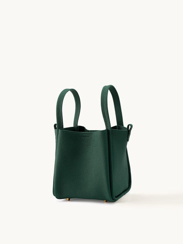 Emerald Medium Song Bag: structured leather bucket bag with two top handles and protective metal feet.