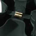 Medium Song Bag in Emerald green leather with gold hardware detail.
