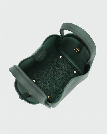 Medium Song Bag in Emerald green, showing its structured bucket design and spacious interior with golden hardware details.