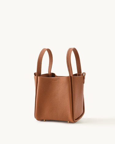 Medium Song Bag in rich brown pebbled leather with dual top handles and gold-tone hardware.